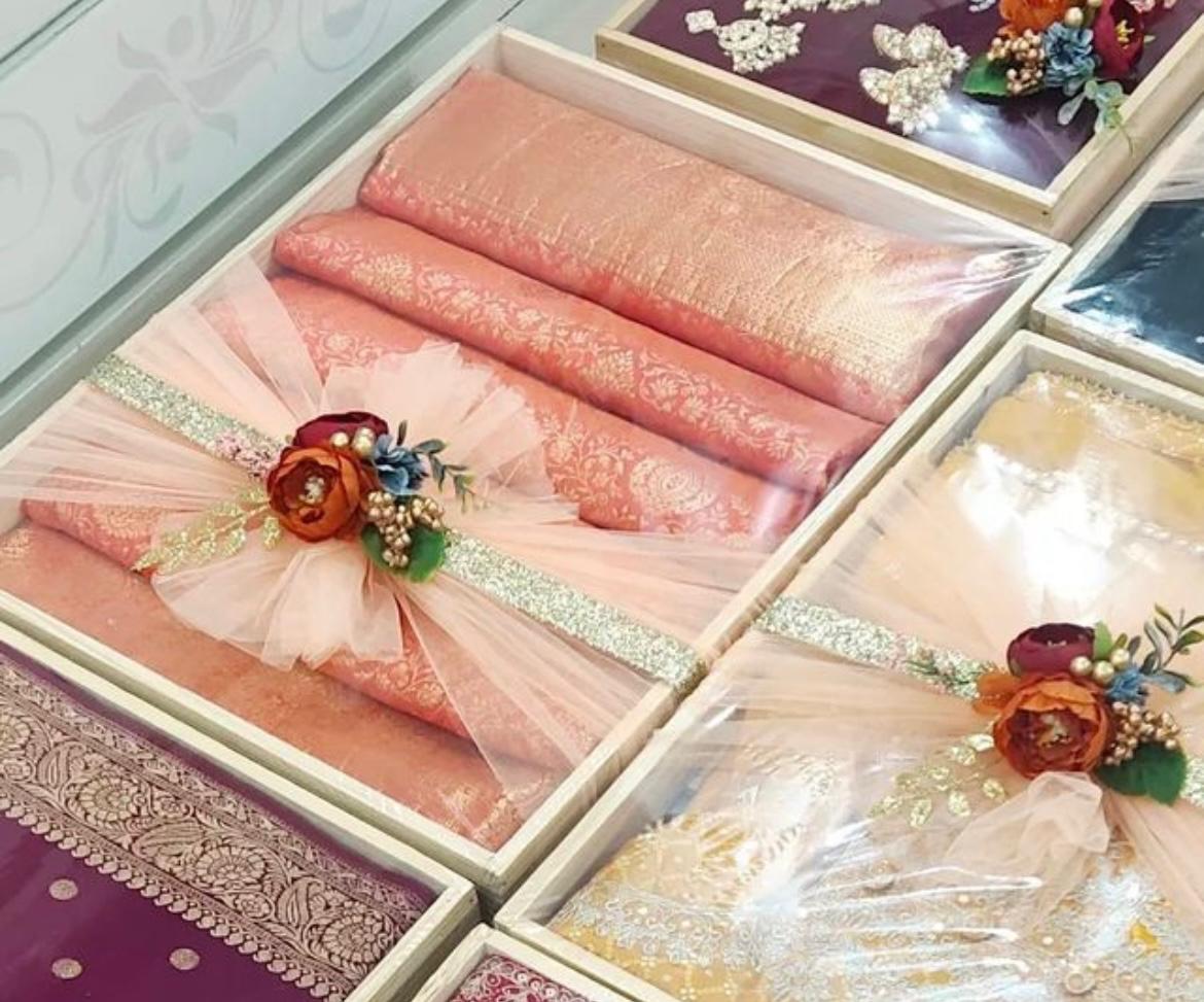 Coral and cream textile collection with delicate floral accents